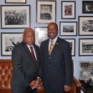 Rep. John Lewis and Chancellor Gary S. May, in posed photo against wall of photos.