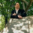 Grounds Division Director Sal Genito is shown by fig trees that began life on the old Mary Chiles Davis homestead &mdash; but are now surrounded by Sproul Hall.