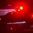 An ambulance with flashing lights at night