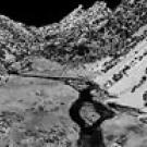 Photo; black and white view of valley, stream and mountains