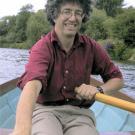 photo: man in row boat