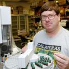 Jack Henderson works in his Meyer Hall lab, wearing a clue to his favorite pastime &Atilde; Scottish games. The Davis resident has a wife, Lisa, and a 5-year-old son, Robert.    