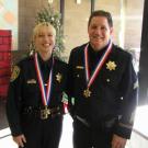 Medal of Valor recipients Officer Franci Abraham and Sgt. Paul Henoch wear the new awards around their necks during a ceremony held Dec. 21 in their honor.