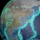 Image: partial of the earth showing Asia and Japan, with blue lights