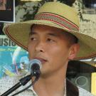 Joaquin Feliciano performs, at microphone