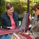Susan Kaiser, left, and Leslie Rabine  examine textiles from Cusco. The two are major players in developing top-notch textile and fashion programs at UC Davis.