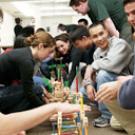 Students enrolled in a contemporary leadership course collaborate on a bridge-building project with help from UC Davis staff member Emily Murdock (not pictured). 