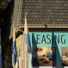 Apartment building with signs offering leases