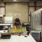 Photo: Malaquias Montoya, making a silkscreen print.