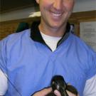 photo: man holding bird
