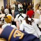 Room full of students and band members 