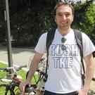 Man standing in T-shirt with backpack straps