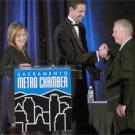 KCRA Channel 3 news anchor Diedre Fitzpatrick, left, looks on as Tom Stallard, right, shakes the hand of Sacramento Metro Chamber CEO Matt Mahood. Stallard, a longtime UC Davis alumni board member, accepted the chamber&rsquo;s Small Business of the 