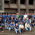 Photo: Building Maintenance Services who participated in the Briggs Hall retrofit, pictured on the Briggs Hall entry staircase