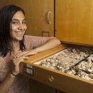 Photo: Natalia Lopez Carranza stands next to open specimen drawer.