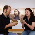A photography exhibit by Shelley Niro provides the backdrop as 
Native American studies graduate students Michael Grofe and Lisa Woodard examine pine needle and sage baskets, respectively, in Carl Gorman Museum. The students say they are excite