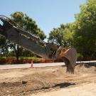 Backhoe works in the Old Davis Road median.