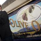 Sal Genito, director of the Buildings and Grounds Division, introduces this year's UC Davis olive oil varieties to a crowd of 500 people at the Silo C