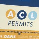 Parking lot sign indicates this lot is for A, C and L permit holders.