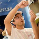 Dawei Lin, when he is not visiting the fair with his children, analyzes DNA at the university's Genome Center.