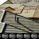 Gerald Clarke Jr. juxtaposes tract housing and Native American baskets in this work.