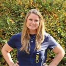 Woman in blue T-shirt posing