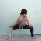 Woman stands in yoga pose