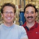 Photo: two men in a laboratory with much equipment