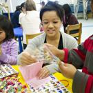 Photo: Trang Nguyen, a third-year textile and clothing major, volunteers during the Feb. 25-26 Weekend of Service.