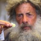 Art Shapiro holds a cabbage white butterfly.