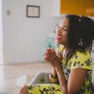 Shena Young environmental, seated on sofa