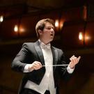 Photo: Student conductor Garrett Rigsby wields baton.