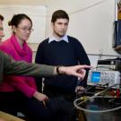 Assistant Professor Jason DeJong, left, and graduate students Brina Mortensen and Brian Martinez are researching a method of strengthening the soil un