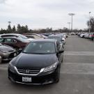 Cars parked in aisle of parking structure.