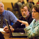 Diane Davies-Conley, right, chief operating officer in the Office of Resource Management and Planning,  talks about energy conservation at the March 21 budget forum as staff members Ward Stewart, middle, and Phil Knox, listen to the discussion. 