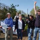 Chancellor Larry Vanderhoef, left, announces Maureen Stanton, second from left, as the recipient of the 2005 UC Davis Prize for Undergraduate Teaching and Scholarly Achievement.  The announcement was met with a round of cheers from   those assem