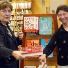 Photo: two women holding diet books