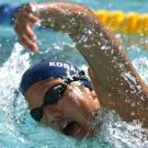 Photo: woman swimming in cap and goggles
