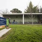Students walk past The Grove, formerly Surge III.