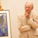 Photo: Wayne Thiebaud addresses gathering, while standing in front of his painting "Yosemite."