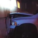 Pickup with front end partially inside residence hall.
