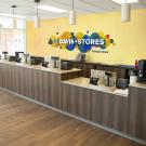 A composite photo showing the future signage that will be displayed behind the counter at the UC Davis Campus Store in the Memor