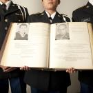 Students hold the Golden Memory Book at UC Davis.