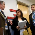 Legislative aide Florence Bernal meets with UC Davis alumni delegates Richard Rominger and Brian Micek.