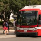 People board a Unitrans bus.