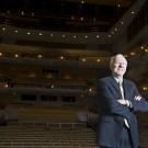 Photo: Portrait of Larry N. Vanderhoef, along in the audience section of the Mondavi Center for the Performing Arts
