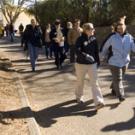 Nearly two dozen people set out on a group walk with Provost Virginia
Hingham, center in the second row, as part of the Winter Walkabout sponsored by Aggie On the Move on Jan. 17. The walk began in the ARC, where the provost gave a short pep ta