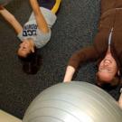New ARC Wellness Manager Raychel Adler, right, takes UC Davis rowing team   member Joan Silva through some exercises.   
