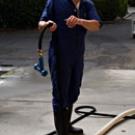 Chik Brennaman works with students during a winemaking class in the Pilot Winery near Wickson Hall. Students are the best part of his job, he said. &ldquo;I see myself 10 years ago.&rdquo;