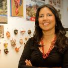 Photo: Zoila Mendoza standing in her decorated office